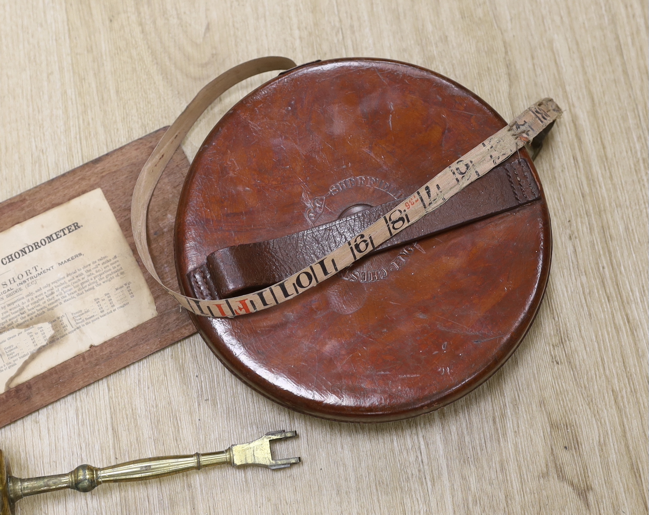 A late Georgian Marratt & Short Improved Chondrometer, a large surveyor's measure and a cast iron protractor